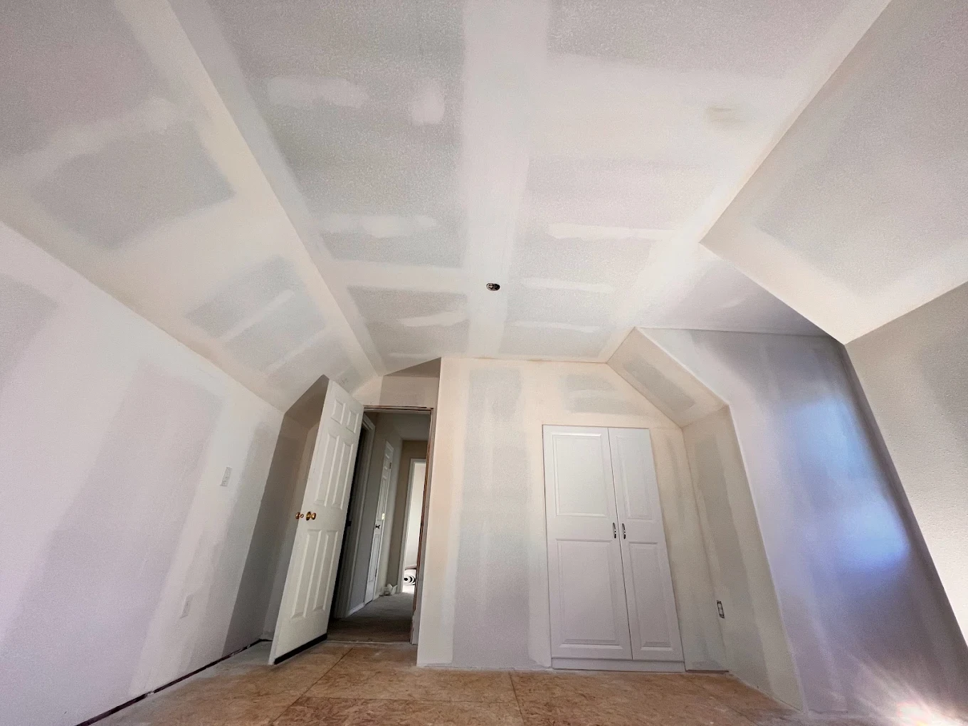 Attic after — smooth finished walls and ceiling